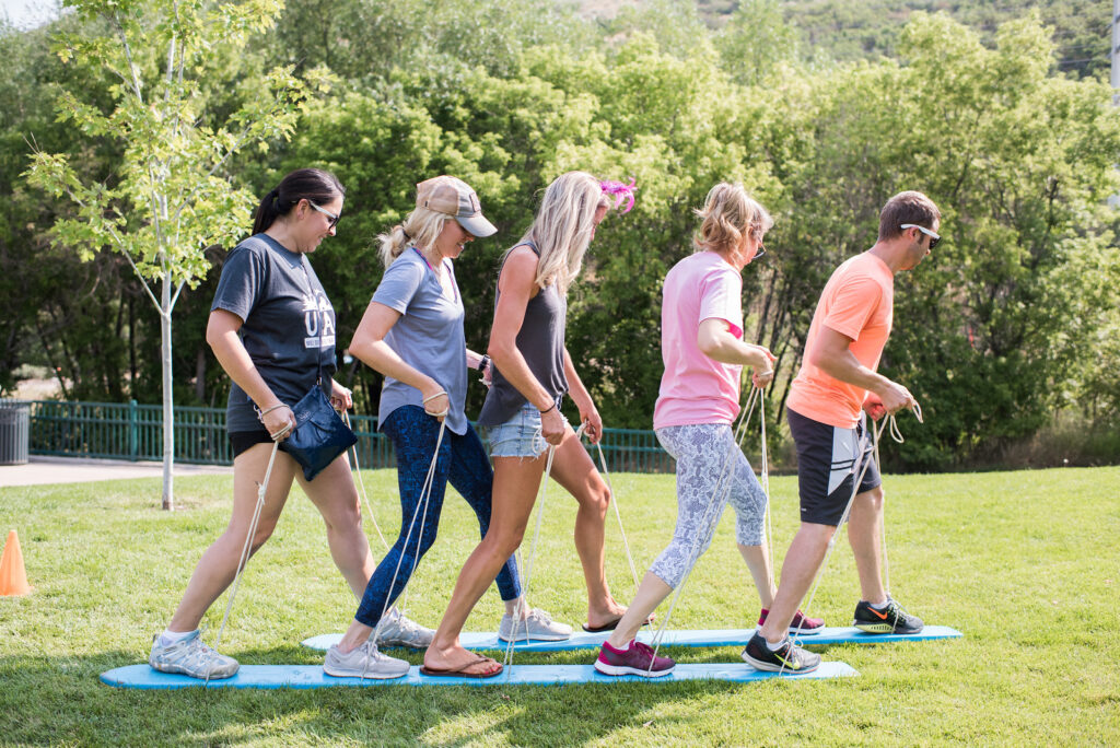 group working together on a silly team building game